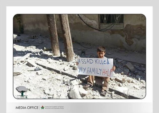 Syria - Sign - Boy amongst ruins